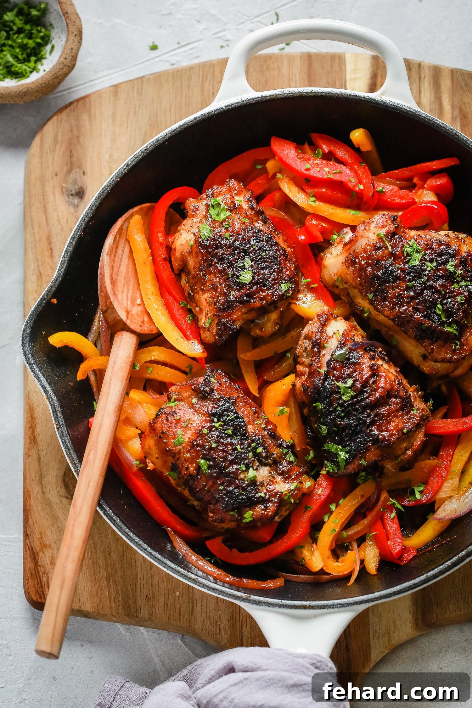 Close-up of Chicken and Bell Peppers Skillet, garnished with fresh herbs.