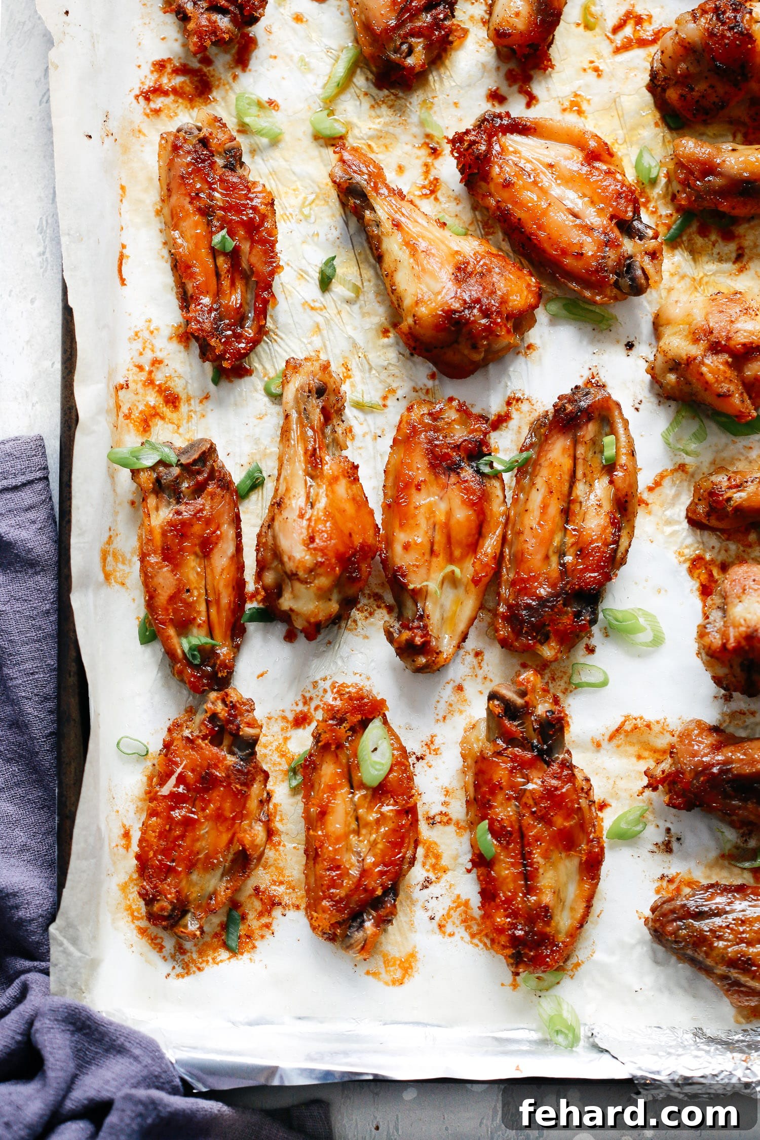 Crispy baked chicken wings on a serving plate