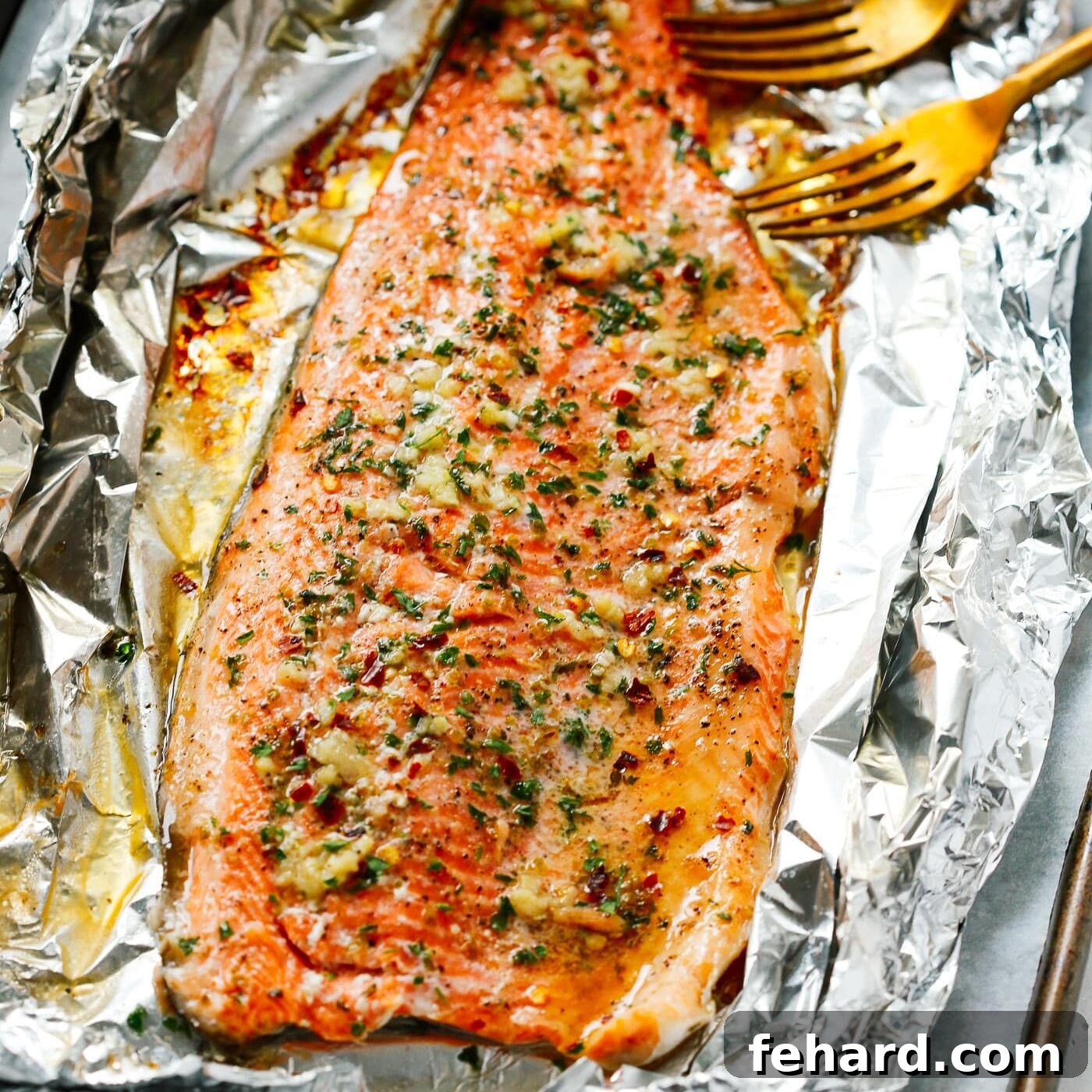 Easter Goodness Guilt Free 4 An overhead view of flavorful salmon fillets baked to perfection in foil, retaining their moisture and delicate texture.