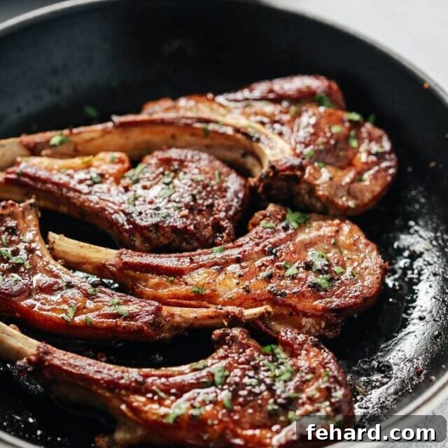 Easter Goodness Guilt Free 5 An overhead view of succulent lamb chops, pan-seared to perfection, served in a pristine white skillet.