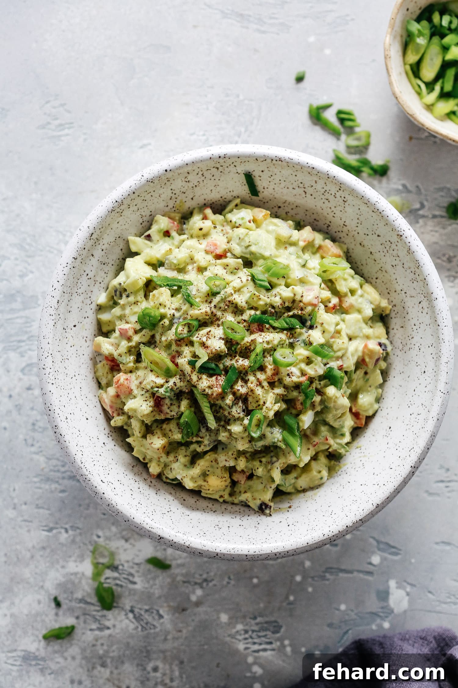 Close-up of creamy Avocado Egg Salad with fresh ingredients
