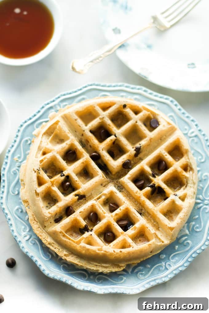 An almond butter waffle on a plate.