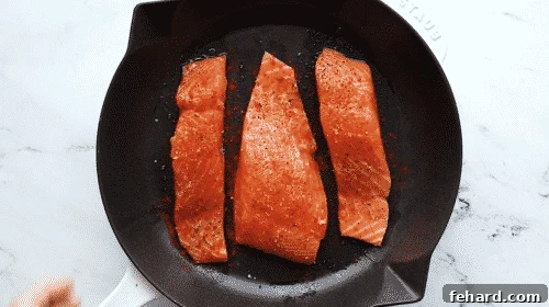 Seasoning salmon fillets with spices