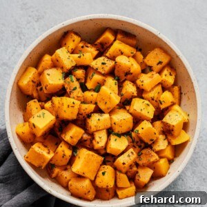 Overhead photo of a white bowl of roasted butternut squash.