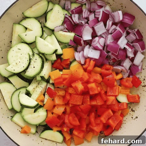 Weekly Shrimp & Veggie Power Bowls 3 overhead view of veggies in a skillet