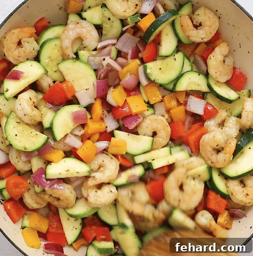 Weekly Shrimp & Veggie Power Bowls 4 overhead view of shrimp and veggies in a skillet