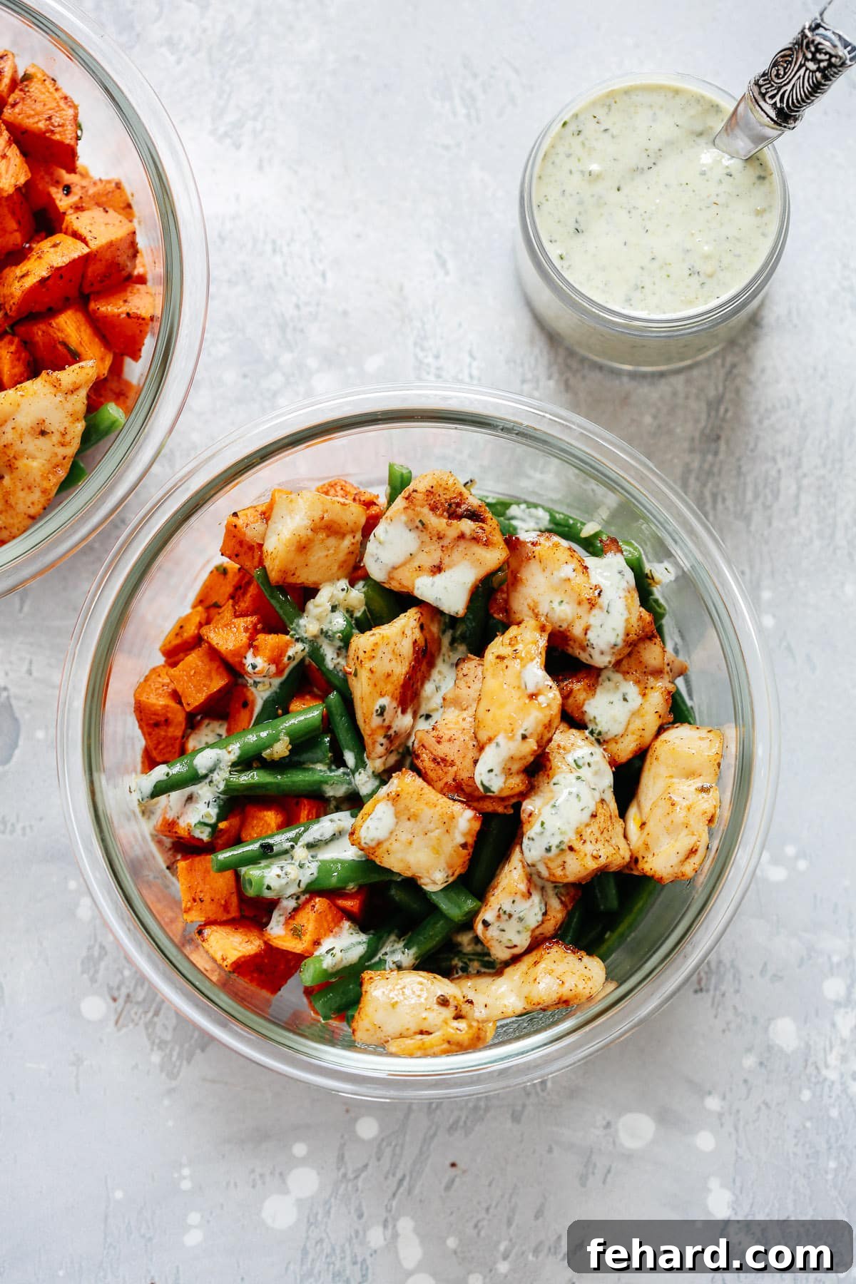 Efficient Chicken and Vegetable Meal Prep 2 Overhead view of chicken and veggies in a glass meal prep bowl