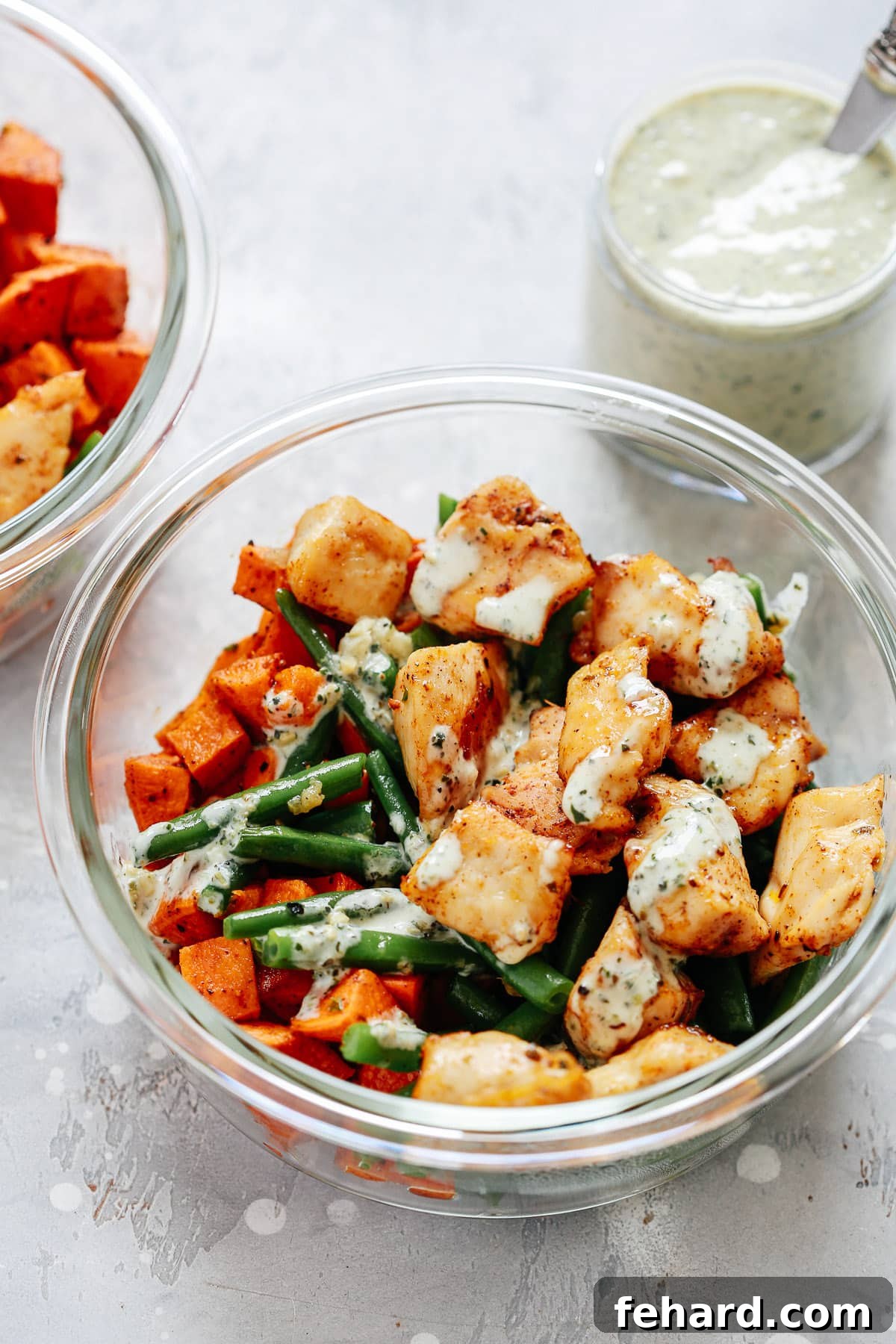 Efficient Chicken and Vegetable Meal Prep 4 chicken and vegetables in creamy pesto sauce in meal prep recipe container