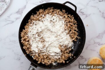 Rich Country Sausage Gravy 6 Browned sausage in skillet with flour sprinkled over the sausage.