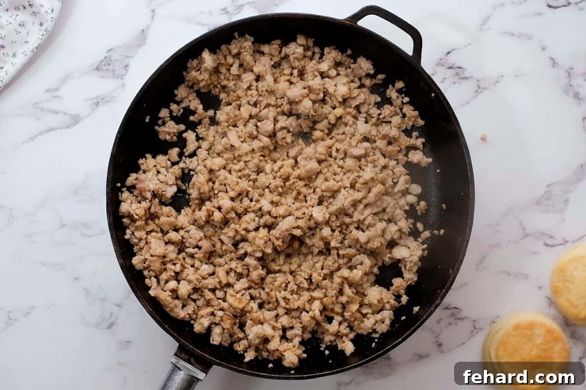 Browned Sausage Perfectly browned sausage crumbles in a cast iron skillet.