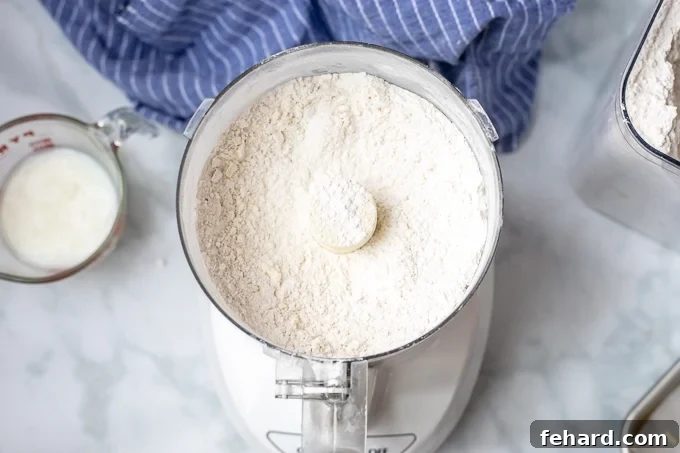 How to Make Buttermilk Biscuits Butter cut into flour in food processor.