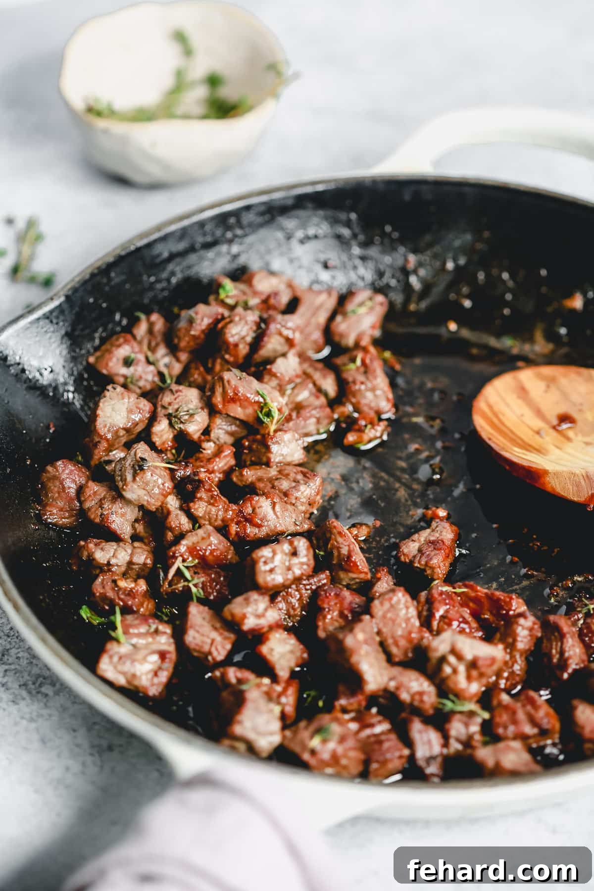Sizzling garlic butter steak bites cooking in a hot skillet, ready for a quick weeknight dinner.