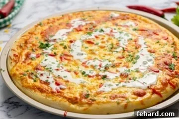 Hot Wing Pizza 9 Baked Buffalo Chicken Pizza with swirl of ranch dressing.