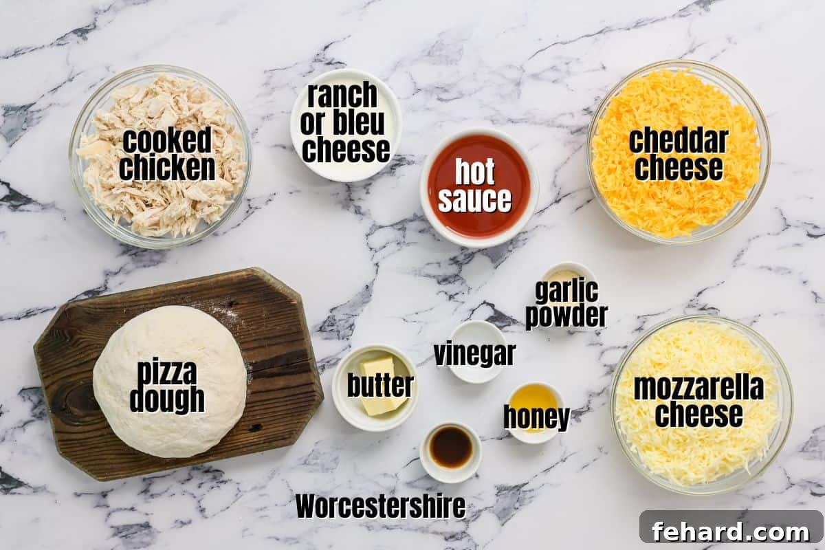 Buffalo Pizza Ingredients - Fresh & Flavorful All the fresh ingredients for homemade buffalo chicken pizza laid out on a kitchen counter, including pizza dough, cooked chicken, various cheeses, and buffalo sauce.