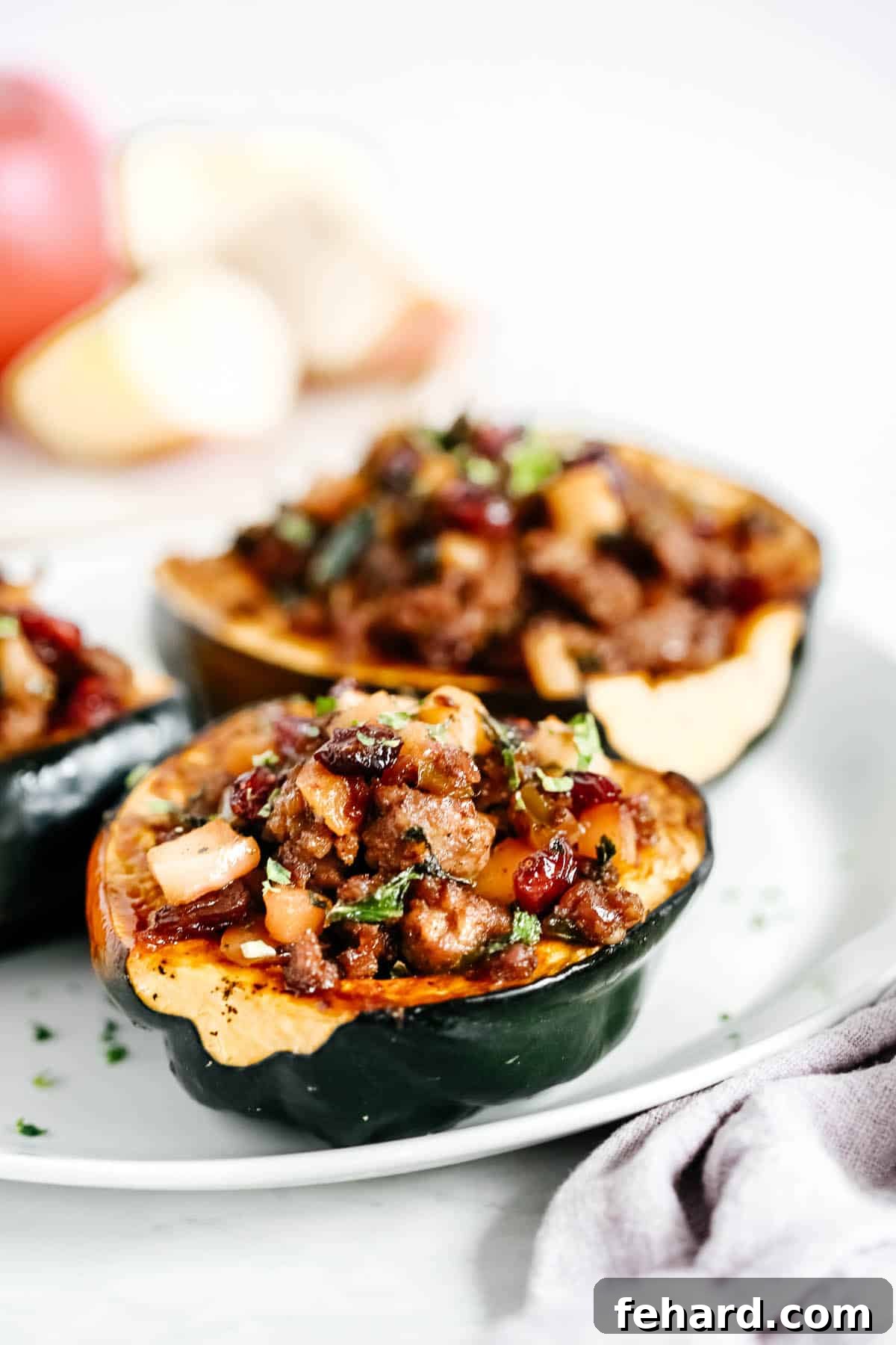 Hearty Sausage-Filled Acorn Squash Bake 3 A vibrant close-up of the cooked sausage and apple filling, perfectly seasoned and ready to be stuffed into acorn squash.