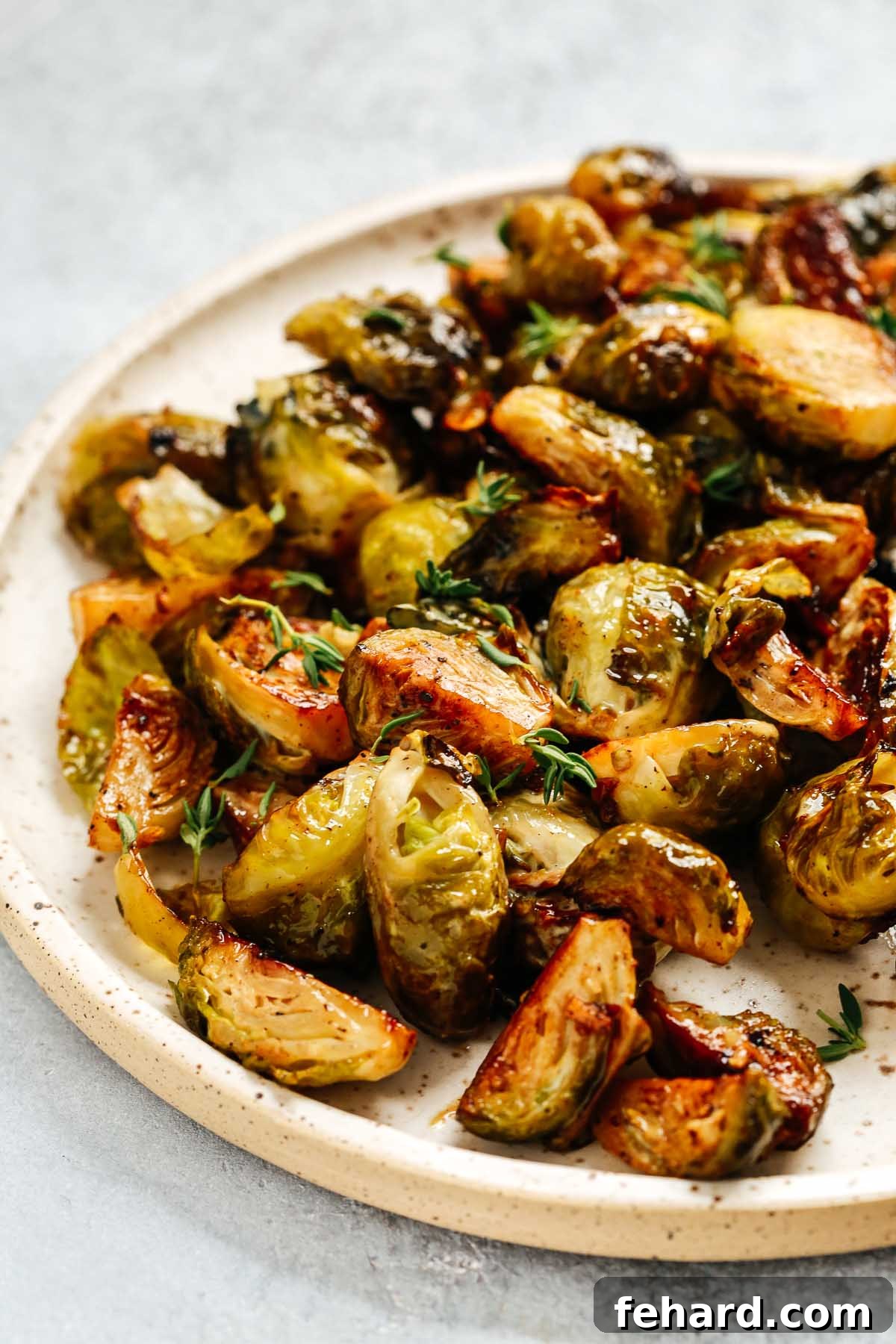Crispy Brussels Sprouts with Tangy Mustard Mayo 4 A serving platter showcasing perfectly roasted Brussels sprouts, garnished with fresh herbs, ready to be served as a healthy and flavorful side dish.