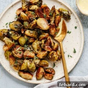 Overhead view of Roasted Brussels sprouts on a serving platter, as prepared in the recipe.