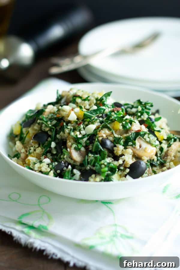 Vibrant Mediterranean Quinoa Salad with Kalamata and Collard Greens 2 A vibrant bowl of Kalamata Collard Quinoa Salad, showcasing fresh greens, red peppers, and olives, perfectly arranged for a healthy and appealing meal.