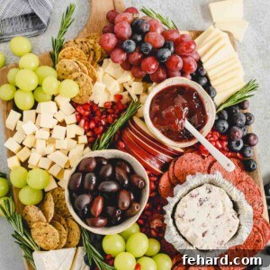 Detailed shot of The Perfect Holiday Cheese Board with an array of cheeses, fruits, and crackers.