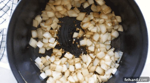 Tender Whole30 Pot Roast 9 sautéed onions and garlic in a Dutch oven pot