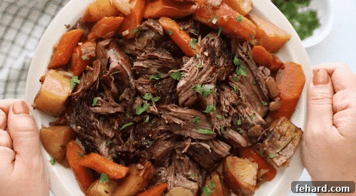 Tender Whole30 Pot Roast 13 overhead view of pot roast in a white plate