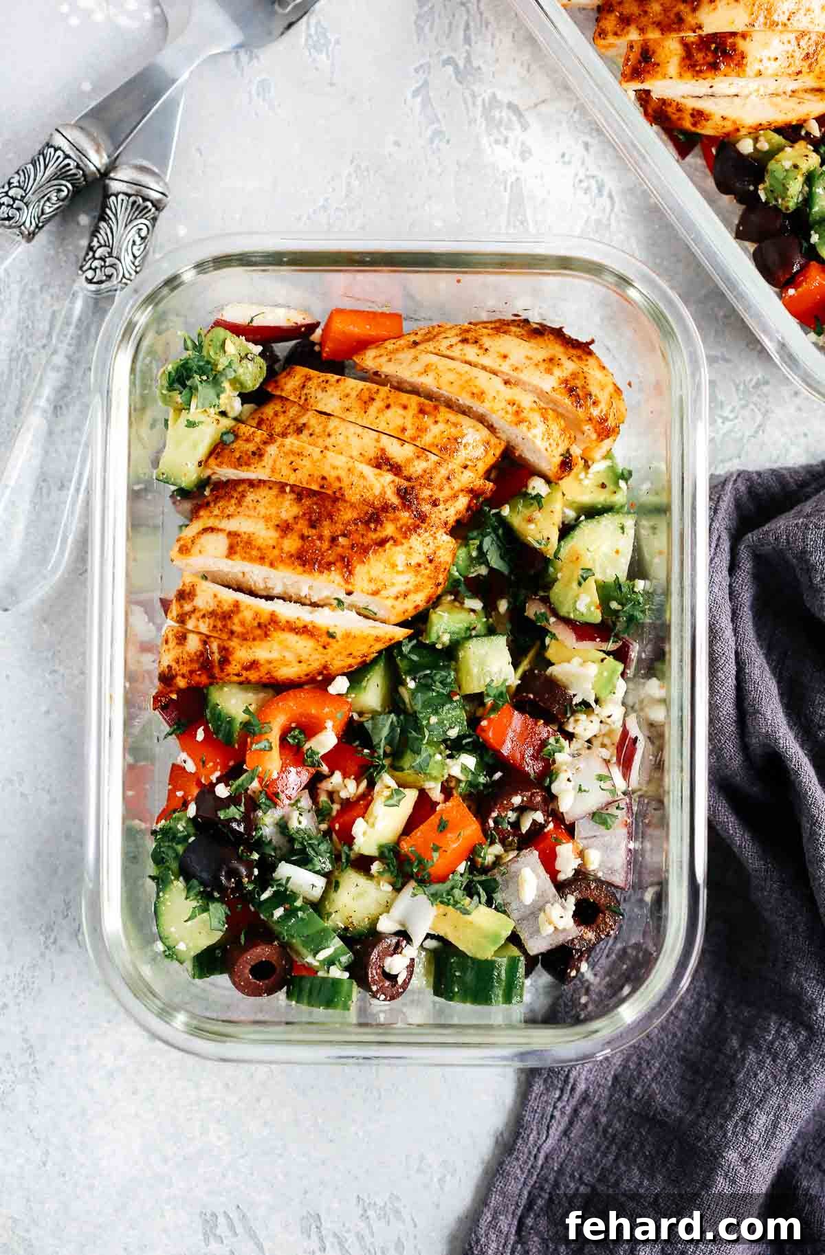 Vibrant Greek Chicken Salad served in individual glass bowls for easy meal prep