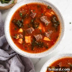 Instant Pot Sweet Potato Kale Beef Soup in a bowl headshot