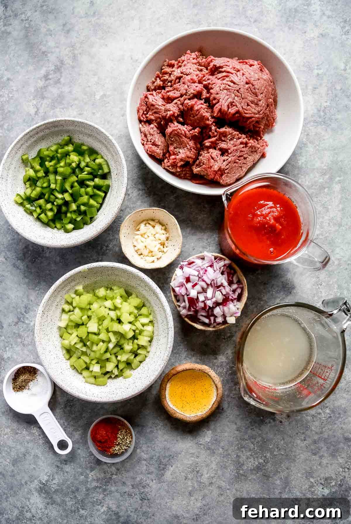 Ultimate Instant Pot Keto Chili 4 bowls and measuring cups holding all the ingredients for keto chili such as ground beef, peppers and onions