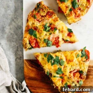 Vegetable frittata cut into pieces on a wooden serving board for the recipe card.