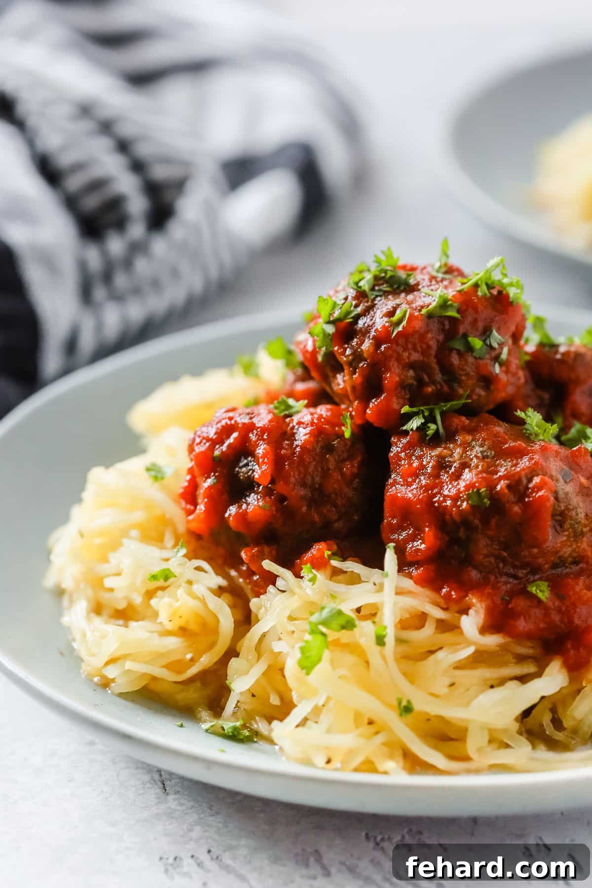 Effortless Keto Dinners 3 Close-up of spaghetti squash and meatballs.