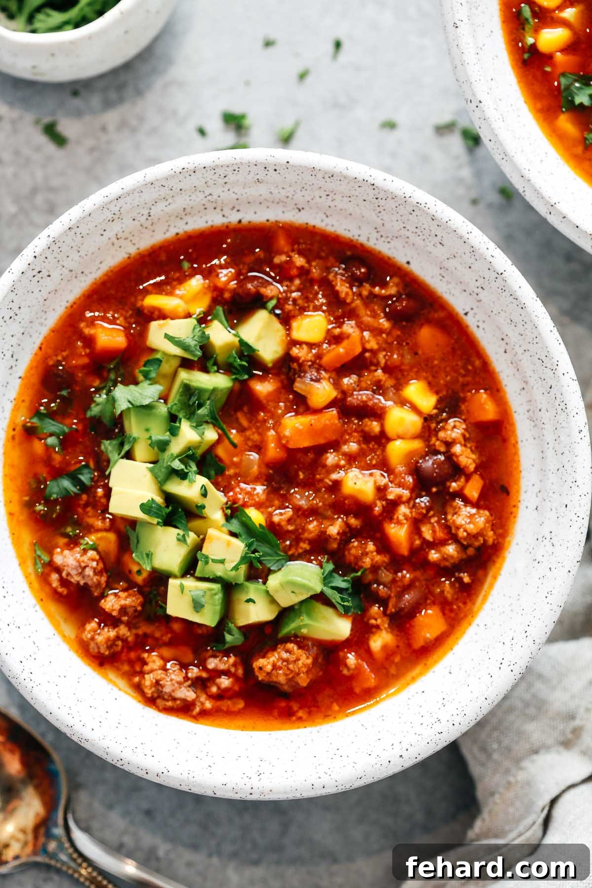 Easy Instant Pot Taco Soup 3 overhead view of Instant Pot taco soup in white bowl