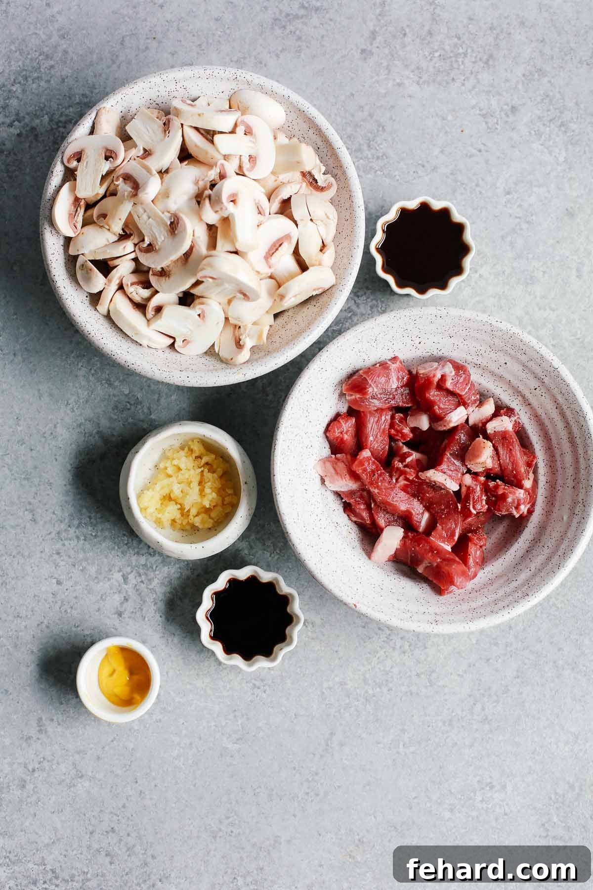 Measured out ingredients for Instant Pot sirloin steak strips recipe including mushrooms, steak, and sauce components