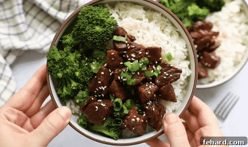 Fast and Flavorful Instant Pot Korean Beef 12 overhead view of Korean beef in a white bowl