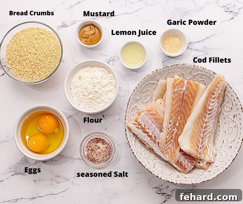 Ingredients for fish sticks laid out on a kitchen counter.