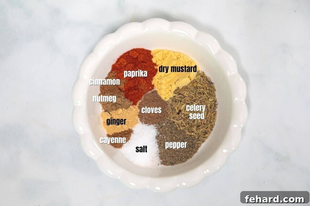 Spices for Old Bay Seasoning Assortment of individual spices for making Old Bay Seasoning laid out in a white dish.