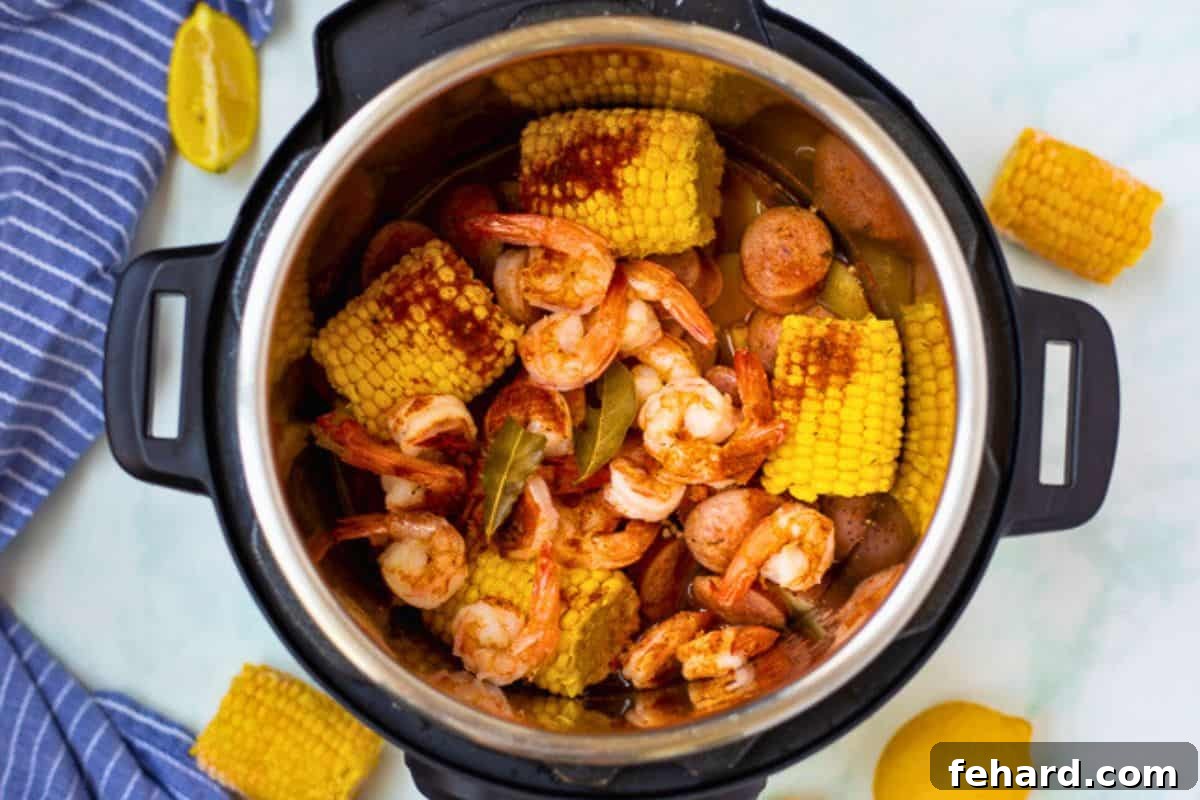 Shrimp boil perfectly cooked inside the Instant Pot with corn, shrimp, and potatoes.