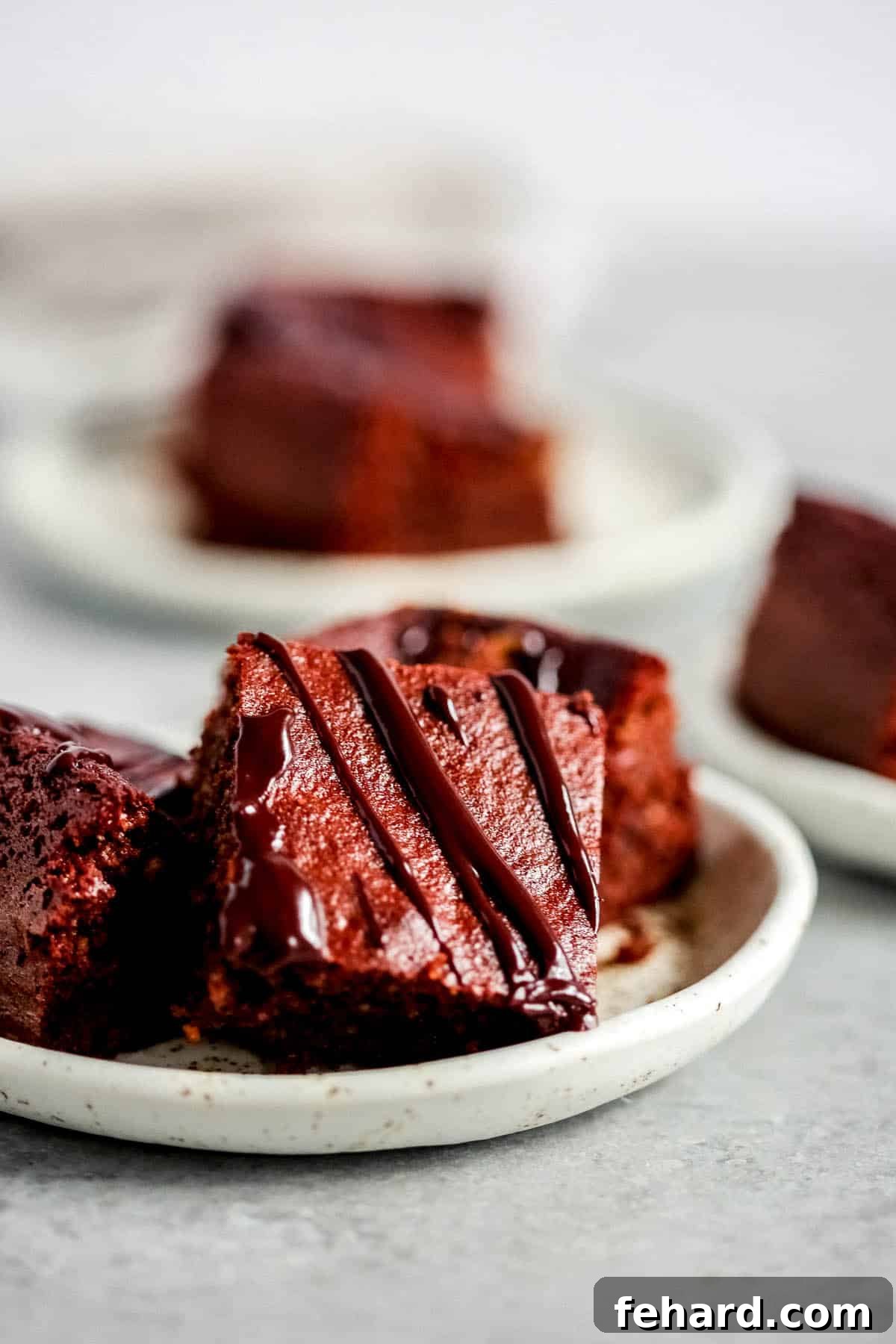 Irresistible Homemade Chocolate Bars 4 Beautifully cut keto chocolate bars adorned with a delicate chocolate drizzle.