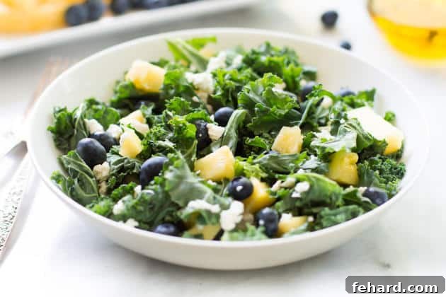 Kale Blueberry Pineapple Salad - A delightful and healthy blend of superfoods. A bowl of vibrant Kale Blueberry Pineapple Salad ready to be enjoyed.