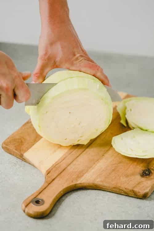 cutting cabbage on a wooden cutting board