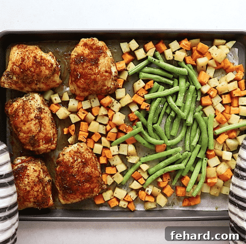 Golden Roasted Chicken and Garden Vegetables 10 overhead view of chicken with vegetables on a baking sheet