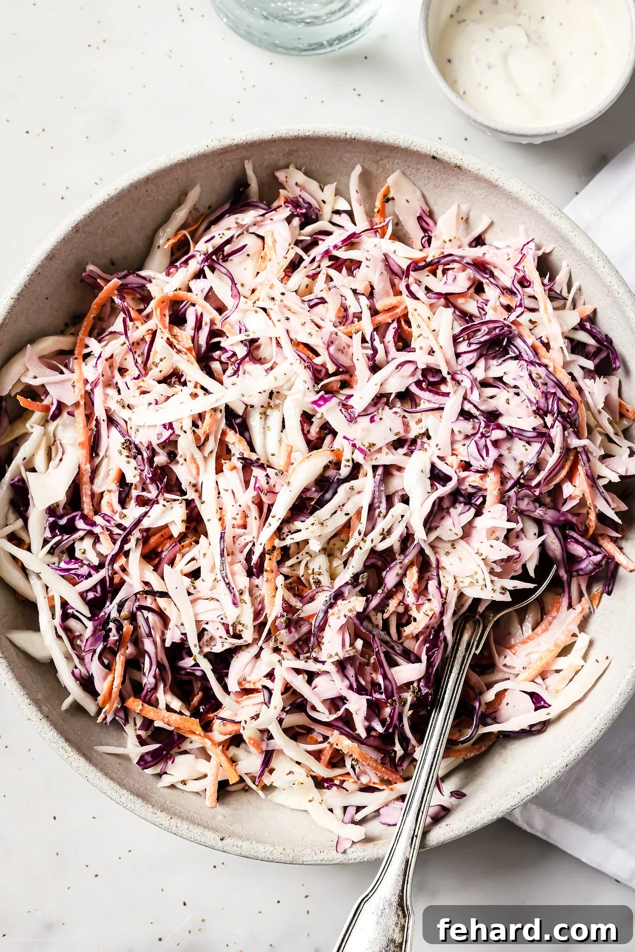 Crisp and Creamy Coleslaw 7 coleslaw salad recipe in a large bowl.