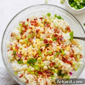 overhead view of a glass bowl containing potato salad