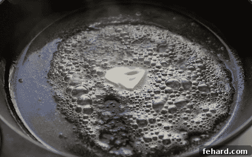 Melted butter shimmering in a hot cast iron skillet