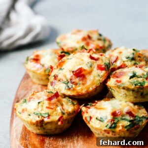 A close up of egg muffins on top of wooden serving board