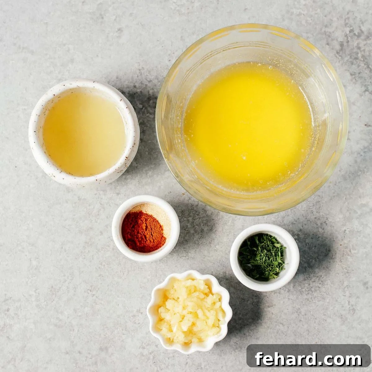 Ingredients arranged on a countertop, ready to make garlic butter baked tilapia.