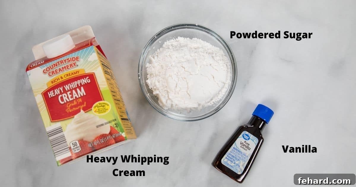 Three essential ingredients for whipped cream: heavy whipping cream, confectioners' sugar, and vanilla extract, arranged on a white counter.