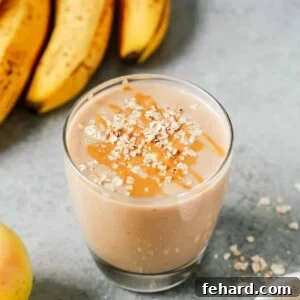 cup of apple smoothie with oats sprinkled on top