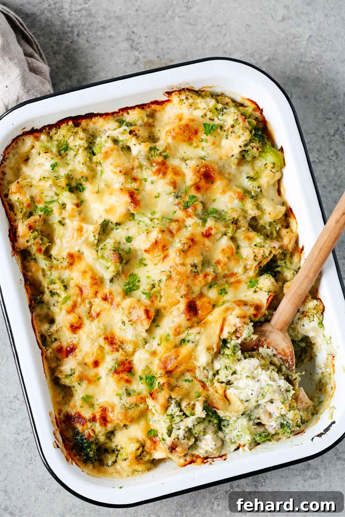 Creamy Broccoli Cauliflower Casserole 2 A golden-brown baked casserole dish brimming with tender broccoli and cauliflower florets, generously topped with melted, bubbly cheese.