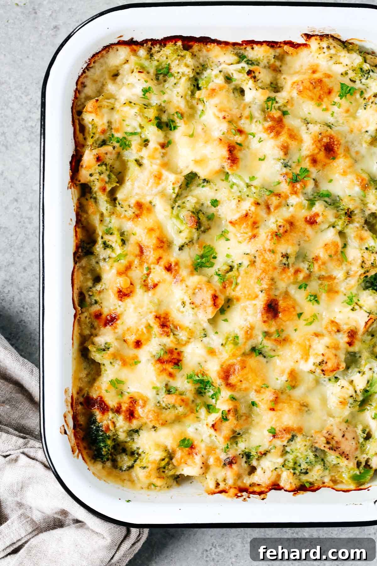Creamy Broccoli Cauliflower Casserole 5 A close-up view of a serving of the creamy, cheesy broccoli and cauliflower casserole, showcasing its delightful texture.