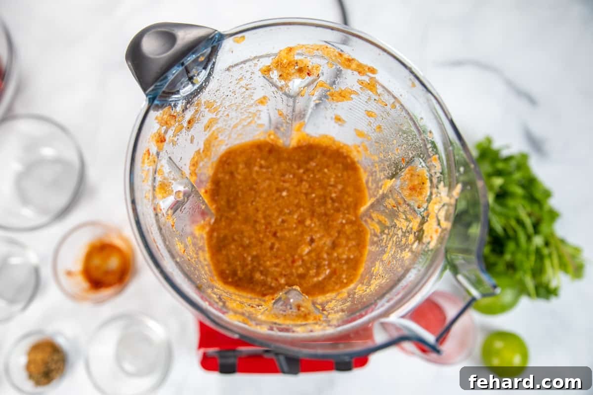 Pressure Cooker Barbacoa Recipe Blender containing Barbacoa Sauce after all ingredients have been thoroughly blended.